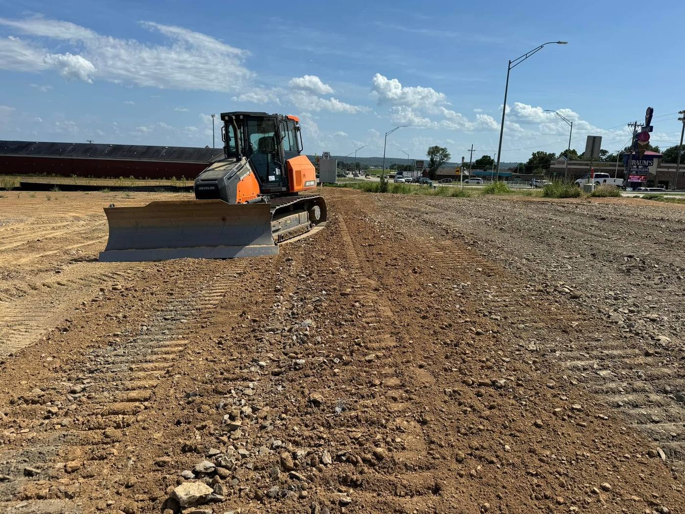 Dozer grading a large cleared site